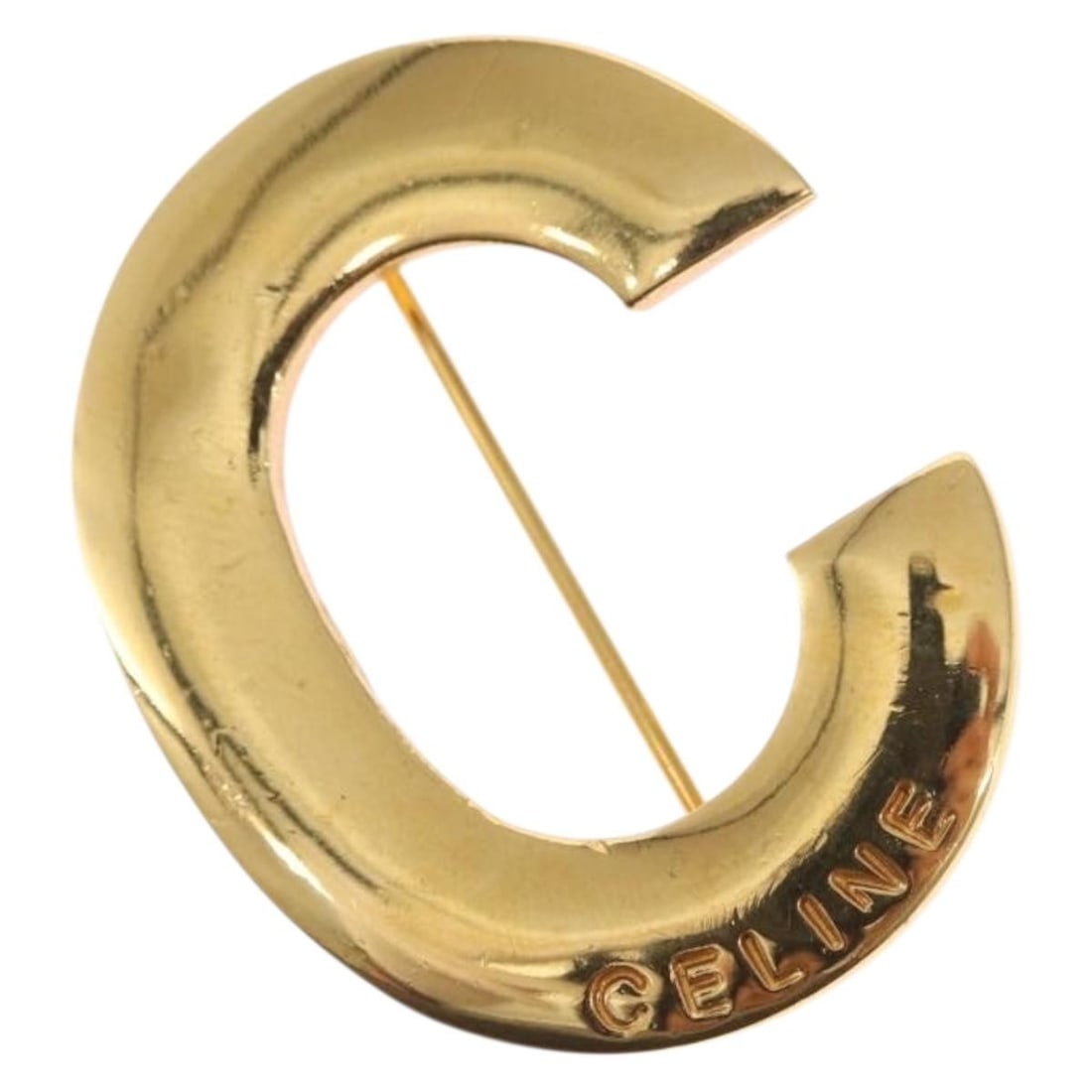 Gold Tone Metal Brooch by CELINE Made in Italy: Gold Tone Metal Brooch by CELINE Made in Italy This CELINE brooch features a gold-tone metal construction and is crafted in Italy. The brooch shows reasonable wear and tear with slight surface scratch