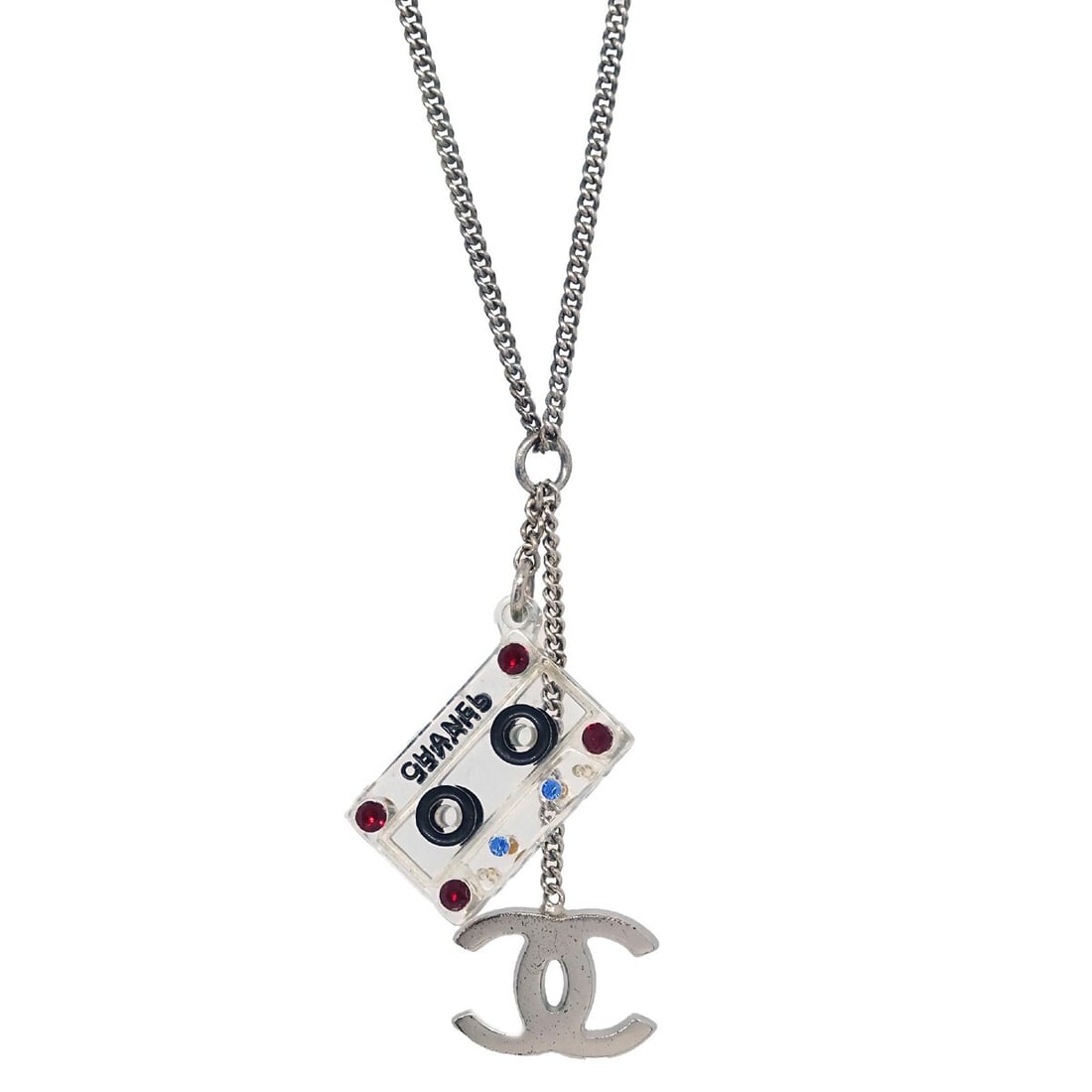 Chanel 04P Cassette Tape Pendant Necklace Silver Plated Rhinestone: Chanel 04P Cassette Tape Pendant Necklace Silver Plated Rhinestone This stunning Chanel CC Cassette Tape Chain Pendant Necklace features a unique cassette tape design, making it a perfect statement pi