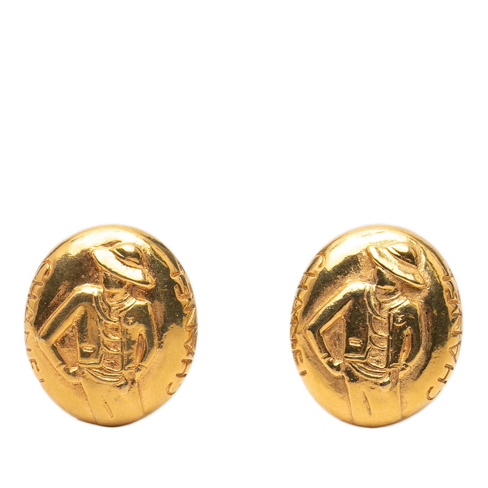 Gold Plated Mademoiselle Clip Earrings by Chanel: Gold Plated Mademoiselle Clip Earrings by Chanel These Chanel clip-on earrings showcase a gold-plated metal Mademoiselle design. Crafted in France, they feature a classic gold color and secure clip-on
