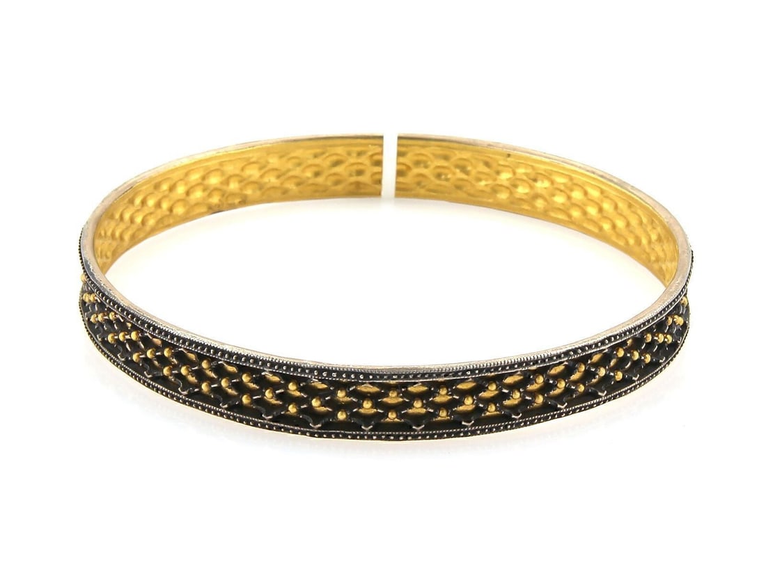 Gurhan 24k Gold Sterling Granulation Bangle 7.75 Inch 8.5mm: Gurhan 24k Gold Sterling Granulation Bangle 7.75 Inch 8.5mm This Gurhan Capitone bangle is a sophisticated bracelet crafted from a blend of 24k gold and sterling silver. Measuring 8.5mm in width and 7