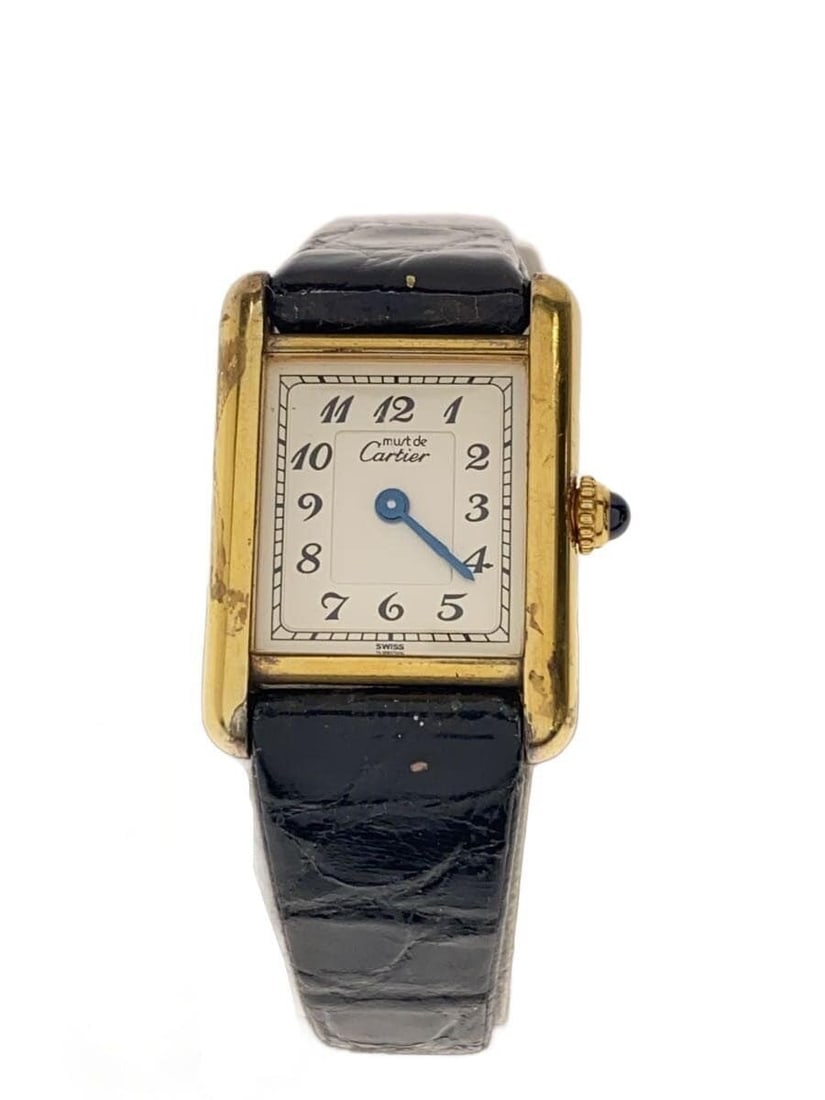 Cartier Must Tank Vermeil Quartz Leather Strap Watch: Cartier Must Tank Vermeil Quartz Leather Strap Watch This Cartier Must Tank Vermeil Quartz 5057001 women's wristwatch is a pre-owned Swiss timepiece featuring an ivory dial, a leather strap (aftermark