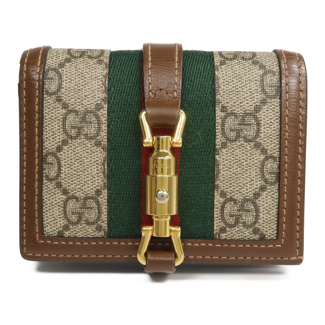 Gucci Jackie 1961 brown PVC coated canvas bi-fold wallet: Gucci Jackie 1961 brown PVC coated canvas bi-fold wallet This is a Gucci Jackie 1961 bi-fold card case wallet crafted from brown PVC coated canvas. Designed for women, it features a compact and functi