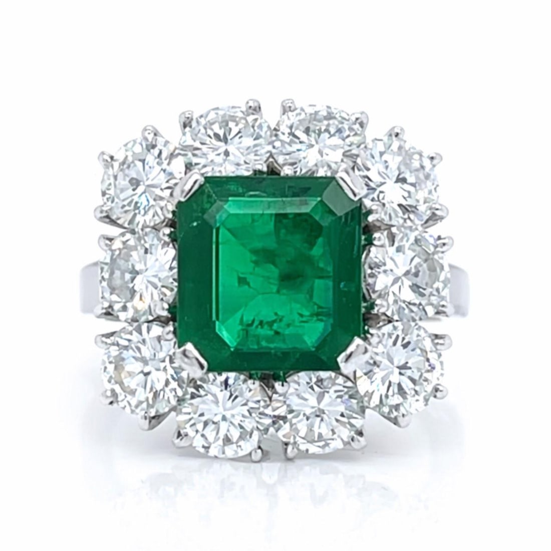 Emerald and Diamond Platinum Ring with 2.50 Ct Emerald Size 5.5: Emerald and Diamond Platinum Ring with 2.50 Ct Emerald Size 5.5 This platinum ring features an approximately 2.50 carat emerald as its centerpiece, complemented by 10 diamonds totaling approximately 2