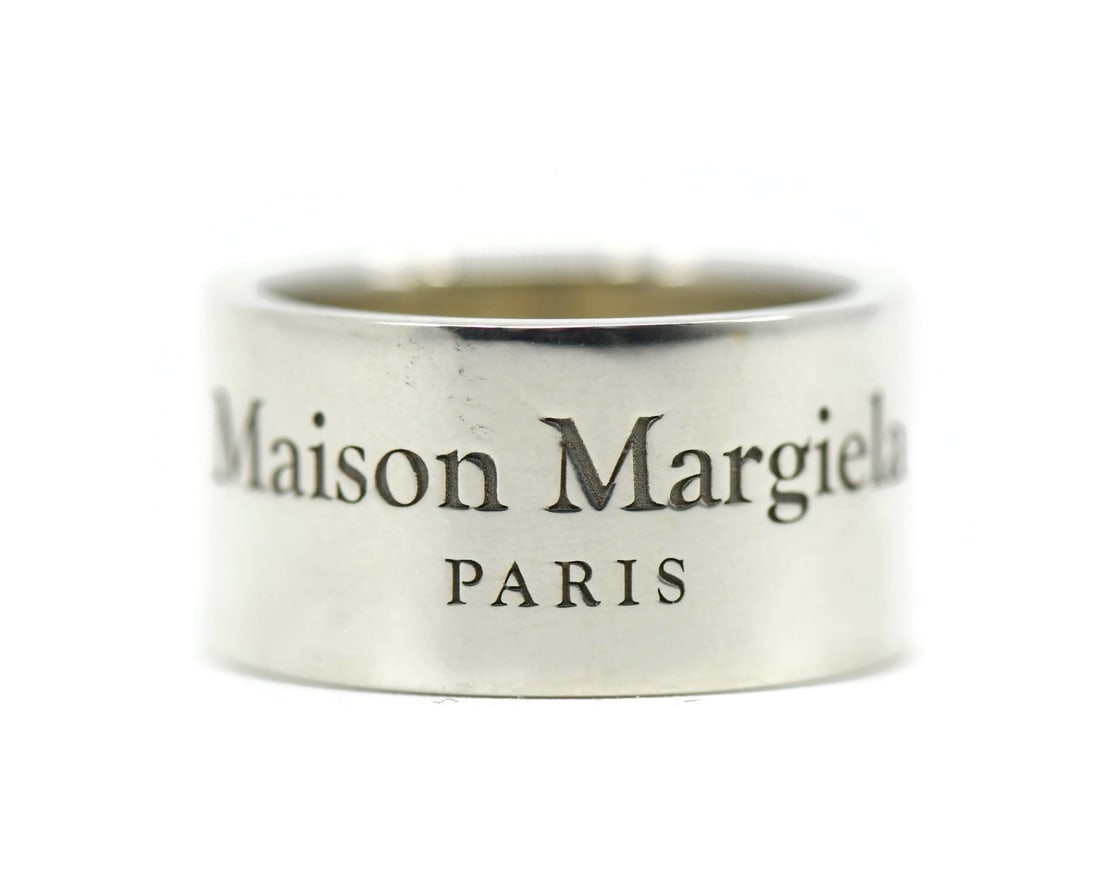 Sterling Silver Ring by Maison Margiela in Size 9: Sterling Silver Ring by Maison Margiela in Size 9 This Maison Margiela ring is crafted from sterling silver with a 925 metal purity. It features a sleek, modern design without any stones and comes in 