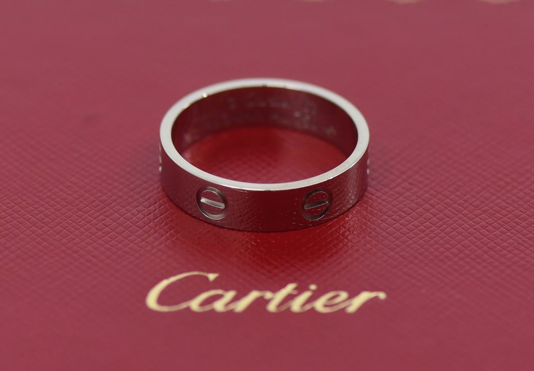 18k White Gold Love Band by Cartier with Box Certificate Size 63: 18k White Gold Love Band by Cartier with Box Certificate Size 63 This Cartier Love ring is crafted from 18K white gold and features the iconic Love motif. The ring is a size 63 (US size 10.5) and is m