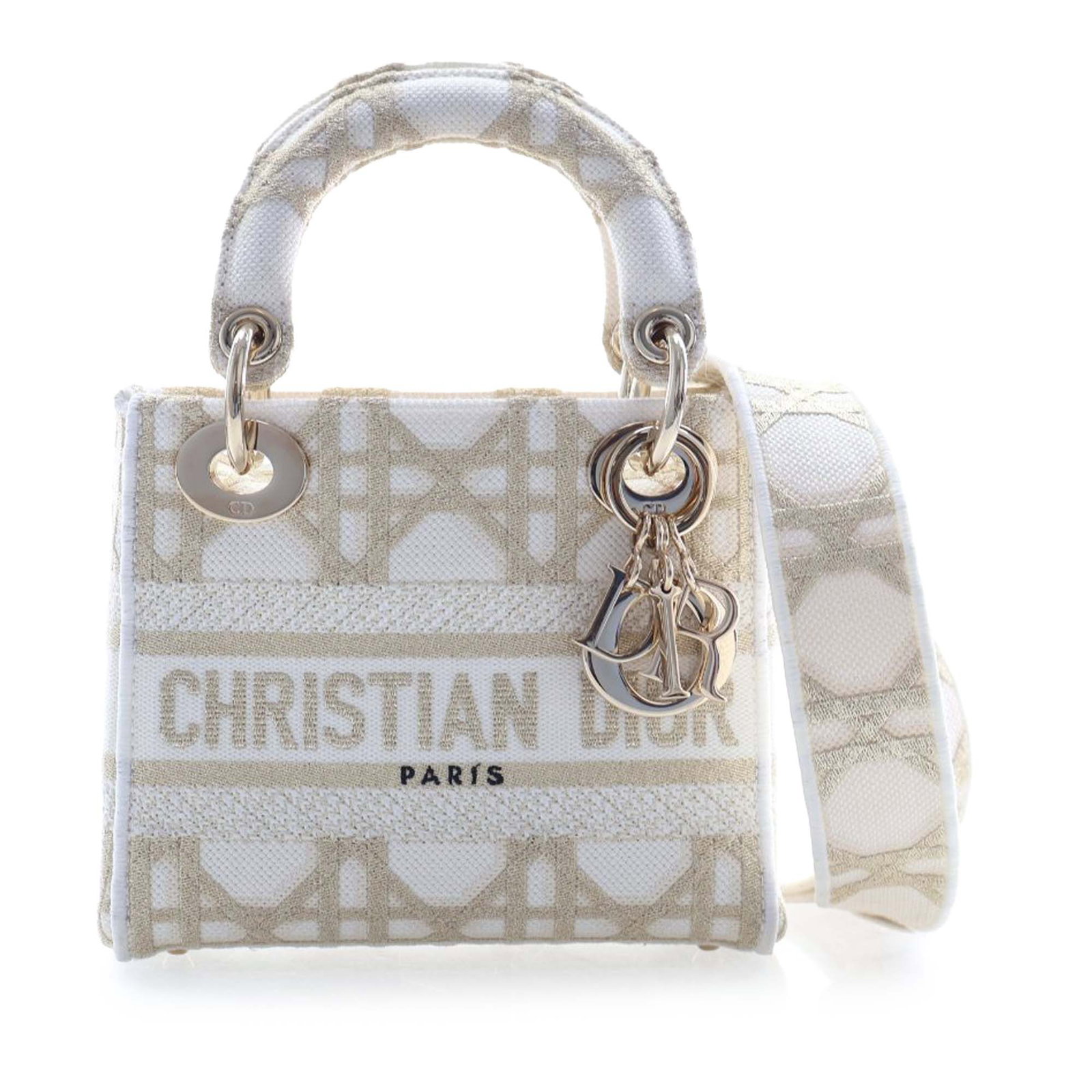 Mini Lady D Lite Bag by Dior in Embroidered Canvas with Cannage Pattern: Mini Lady D Lite Bag by Dior in Embroidered Canvas with Cannage Pattern The Lady D-Lite Mini bag features a white embroidered canvas body with the Cannage motif, structured handles, a detachable flat 
