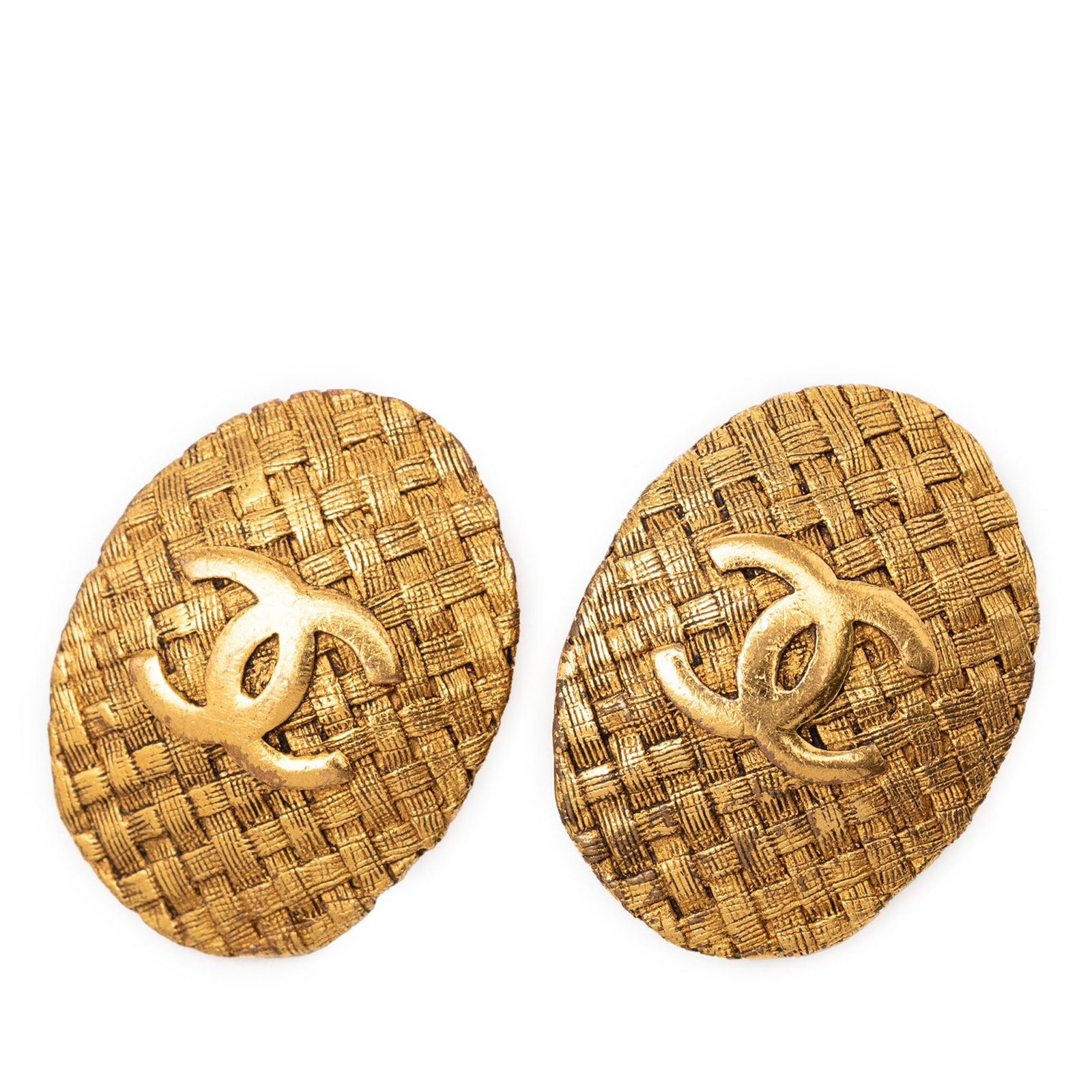 Chanel Woven Oval Clip-On Earrings in Gold Plated Metal: Chanel Woven Oval Clip-On Earrings in Gold Plated Metal These Chanel earrings feature a gold-plated metal body with an oval woven design and a clip-on closure. Made in France, they are categorized as 