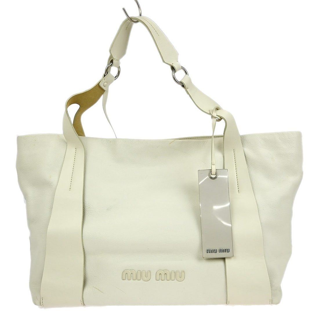 Miu Miu White Leather Vintage Tote Bag 16 in: Miu Miu White Leather Vintage Tote Bag 16 in This vintage Miu Miu tote handbag is crafted from white leather and features a spacious large size with double leather handles. The bag is lined with brown