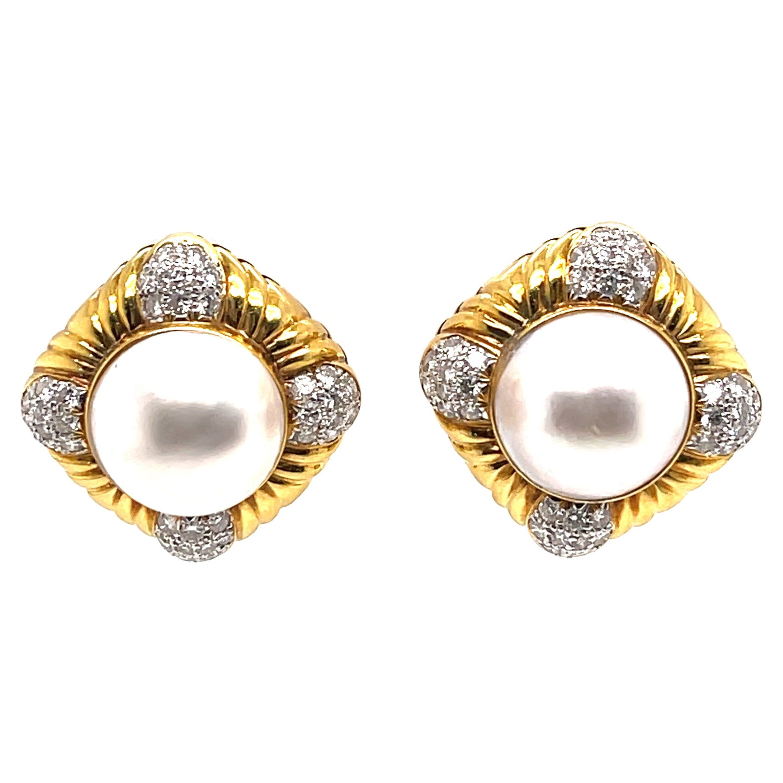 Contemporary Yellow Gold Pearl Diamond Earrings 0.88in 1990s: Contemporary Yellow Gold Pearl Diamond Earrings 0.88in 1990s This exquisite pair of Yellow Gold Pearl Diamond Earrings features round-cut diamonds and lustrous pearls, elegantly set in a contemporary 