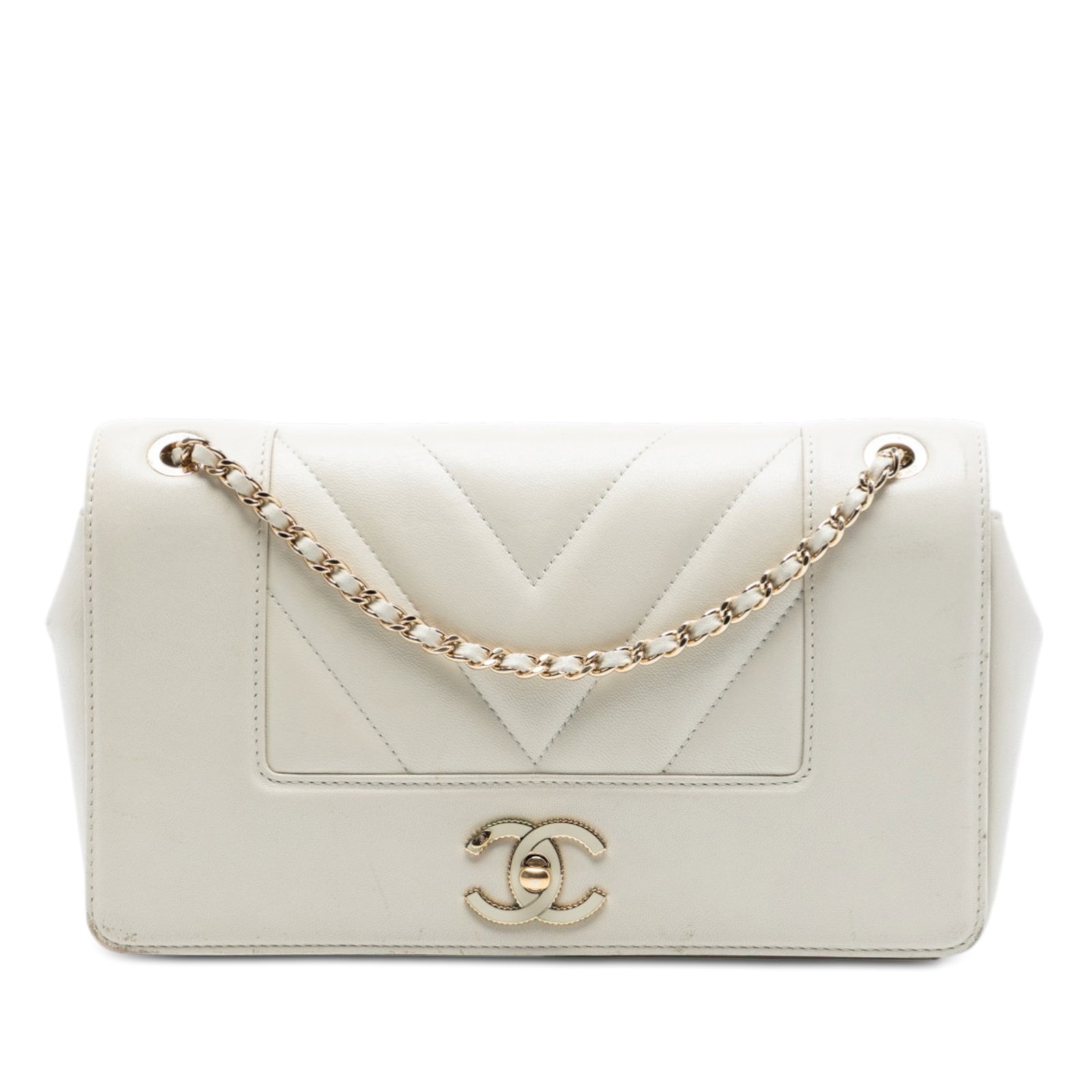 White Sheepskin Chevron Quilted Crossbody by Chanel Mademoiselle Medium Flap: White Sheepskin Chevron Quilted Crossbody by Chanel Mademoiselle Medium Flap This Chanel Medium Chevron Sheepskin Mademoiselle Vintage Flap crossbody bag features a quilted leather body in white, a le