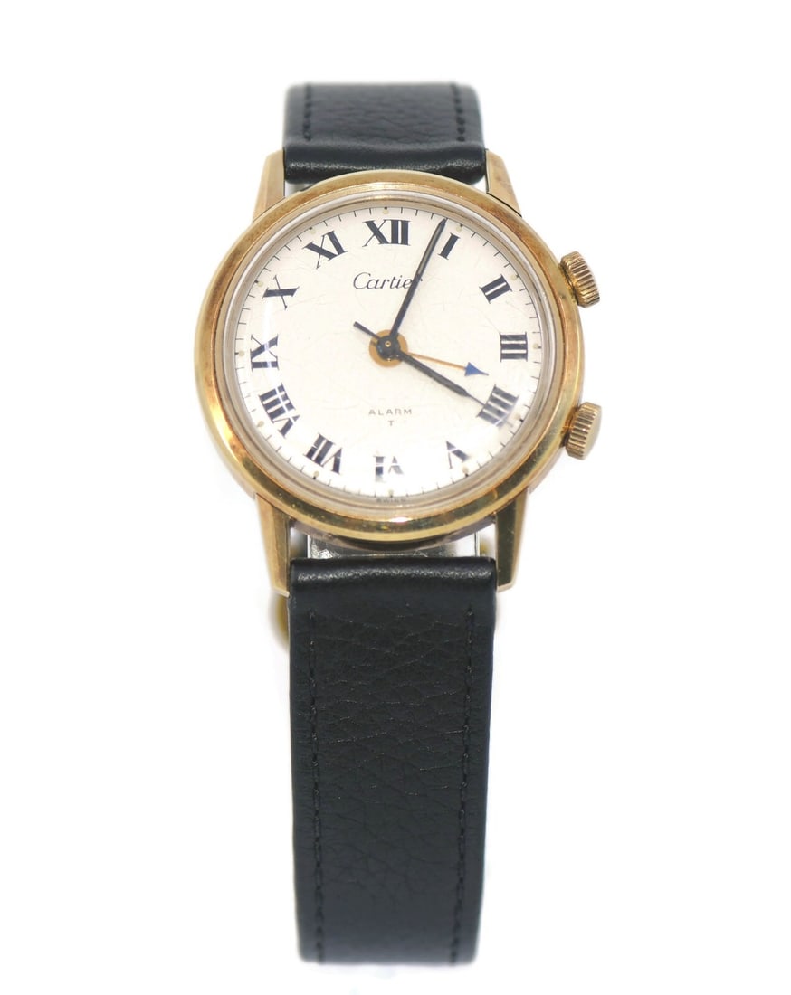 Cartier Alarm 14K Yellow Gold Wristwatch 33mm Authentic: Cartier Alarm 14K Yellow Gold Wristwatch 33mm Authentic Experience the elegance of this Cartier Alarm wristwatch, crafted from luxurious 14K yellow gold. Featuring a mechanical (manual) movement, this