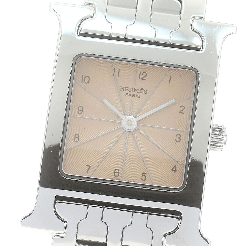 Hermes H-Watch Quartz Stainless Steel Womens Wristwatch HH1.210: Hermes H-Watch Quartz Stainless Steel Womens Wristwatch HH1.210 This Hermes H-Watch HH1.210 is a pre-owned women's wristwatch crafted in Switzerland. It features a stainless steel case and bracelet, c
