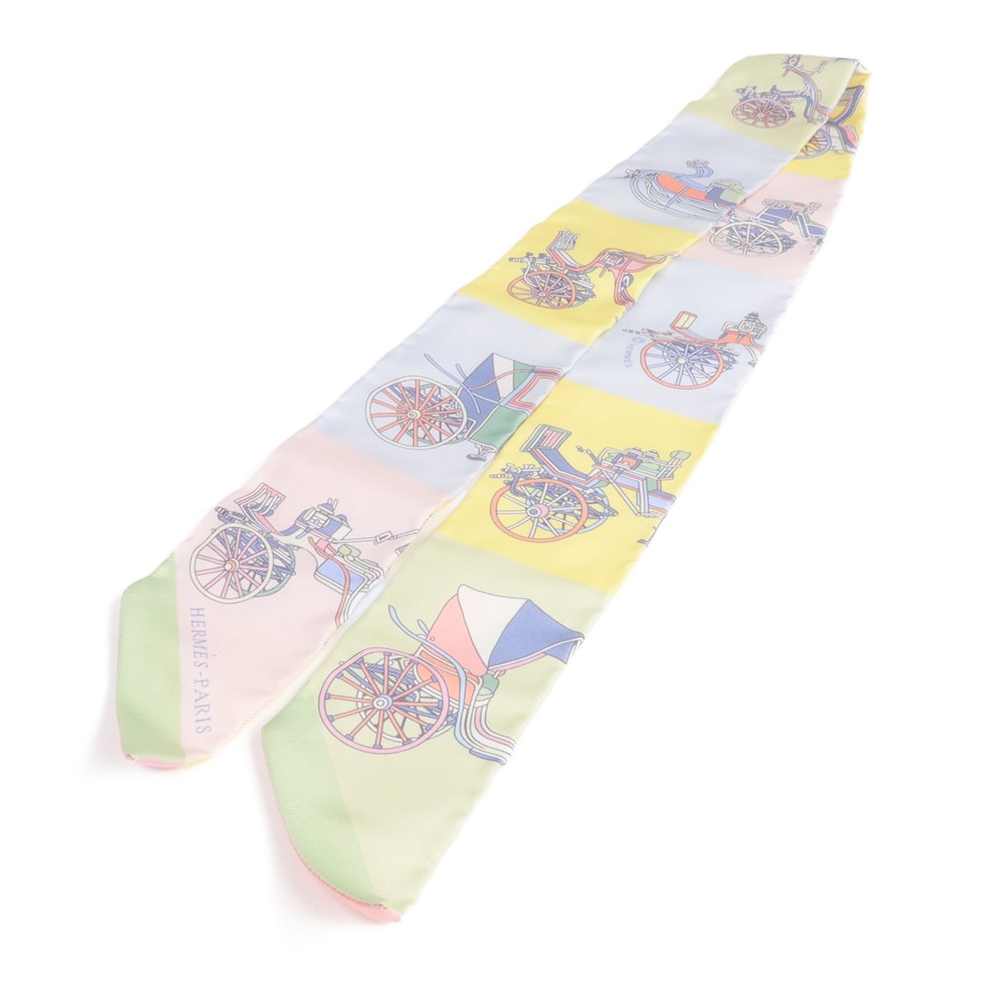 Silk Multicolor Twilly Scarf by Hermes for Women: Silk Multicolor Twilly Scarf by Hermes for Women This Hermes Twilly scarf is crafted from luxurious silk and features a vibrant multicolor design in shades of pink, green, yellow, and blue. Designed f