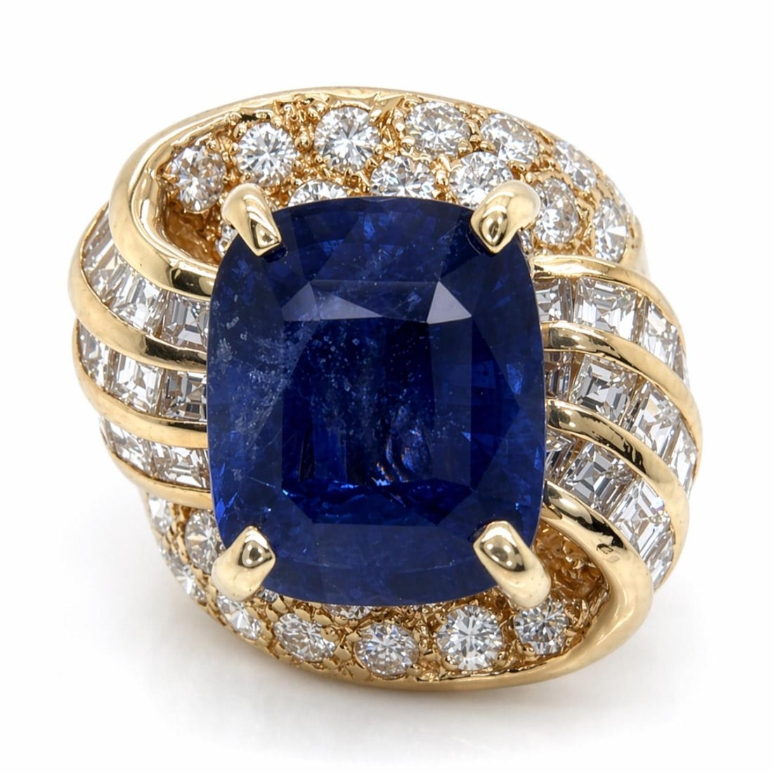 Sapphire and Diamond Ring in 14K Yellow Gold 8.91 Carat Center Stone: Sapphire and Diamond Ring in 14K Yellow Gold 8.91 Carat Center Stone This pre-owned ring features an 8.91 carat sapphire set in 14K yellow gold. The ring is adorned with 38 diamonds totaling approxima