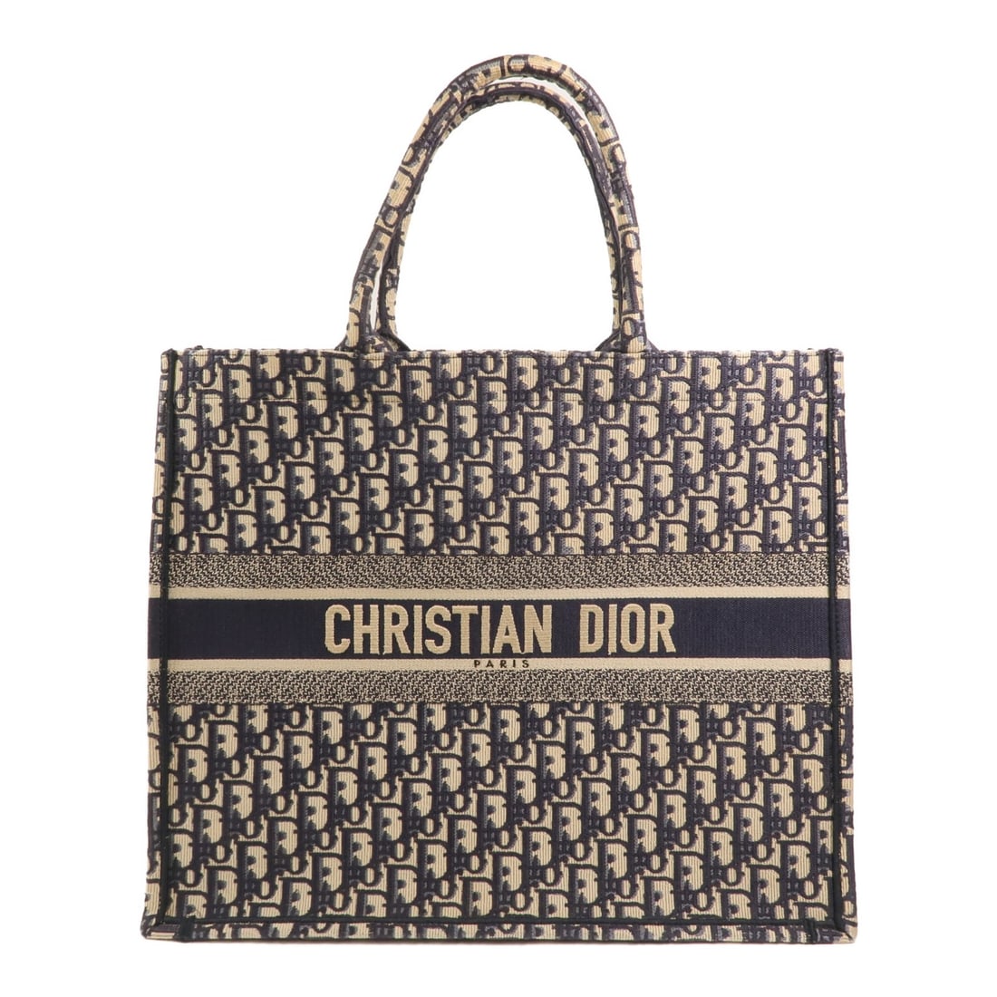 Dior Blue Canvas Book Tote Large: Dior Blue Canvas Book Tote Large This Christian Dior CD Book Tote is a large tote bag crafted from blue canvas. Designed for women, it features a spacious interior, making it suitable for daily use. T