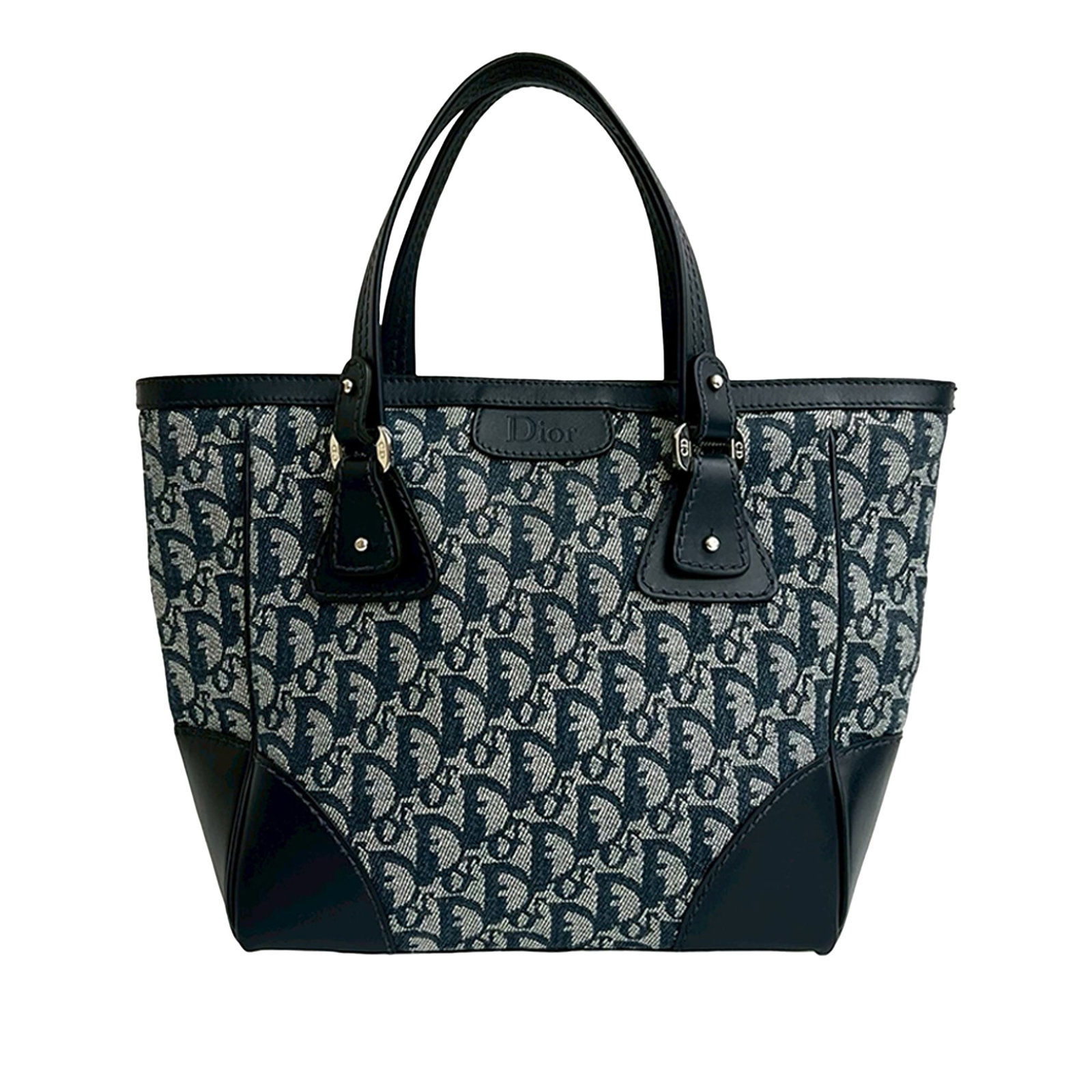 Dior Diorissimo Trotter Blue Canvas Tote Bag with Leather Trim: Dior Diorissimo Trotter Blue Canvas Tote Bag with Leather Trim This Diorissimo Trotter Canvas Zip Tote features a blue canvas body with leather trim, flat leather handles, a top zip closure, and inter
