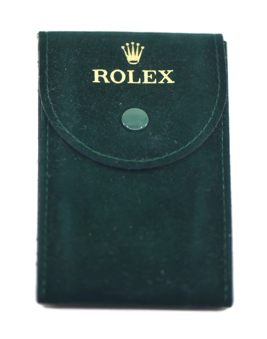 Green Travel Watch Pouch by Rolex: Green Travel Watch Pouch by Rolex This is a pre-owned Rolex travel pouch in green, designed for storing or transporting a watch. Made in Switzerland, it offers a convenient and stylish way to protect 