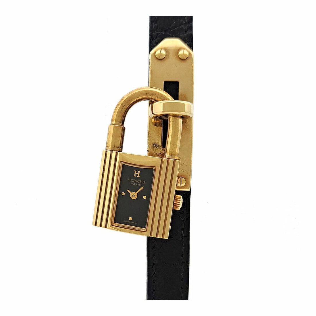 Hermes Kelly Quartz Gold Plated Ladies Wristwatch Box KE1.201: Hermes Kelly Quartz Gold Plated Ladies Wristwatch Box KE1.201 This Hermes Kelly Watch KE1.201 is a pre-owned women's wristwatch crafted in Switzerland. Featuring a gold-plated case and a black dial, i