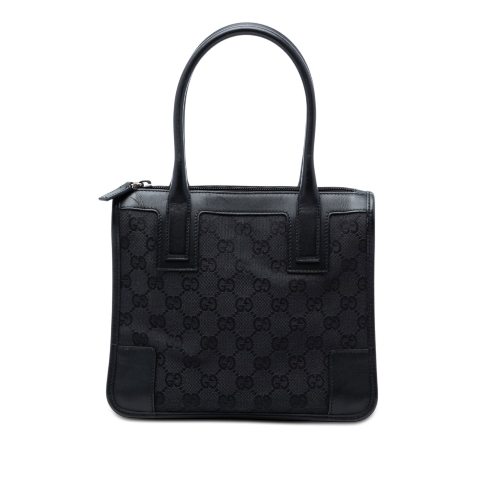 Black GG Canvas Satchel with Leather Trim by Gucci: Black GG Canvas Satchel with Leather Trim by Gucci This Gucci GG Canvas Handbag features a canvas body with leather trim, rolled leather handles, a top zip closure, and an interior zip pocket. The bag