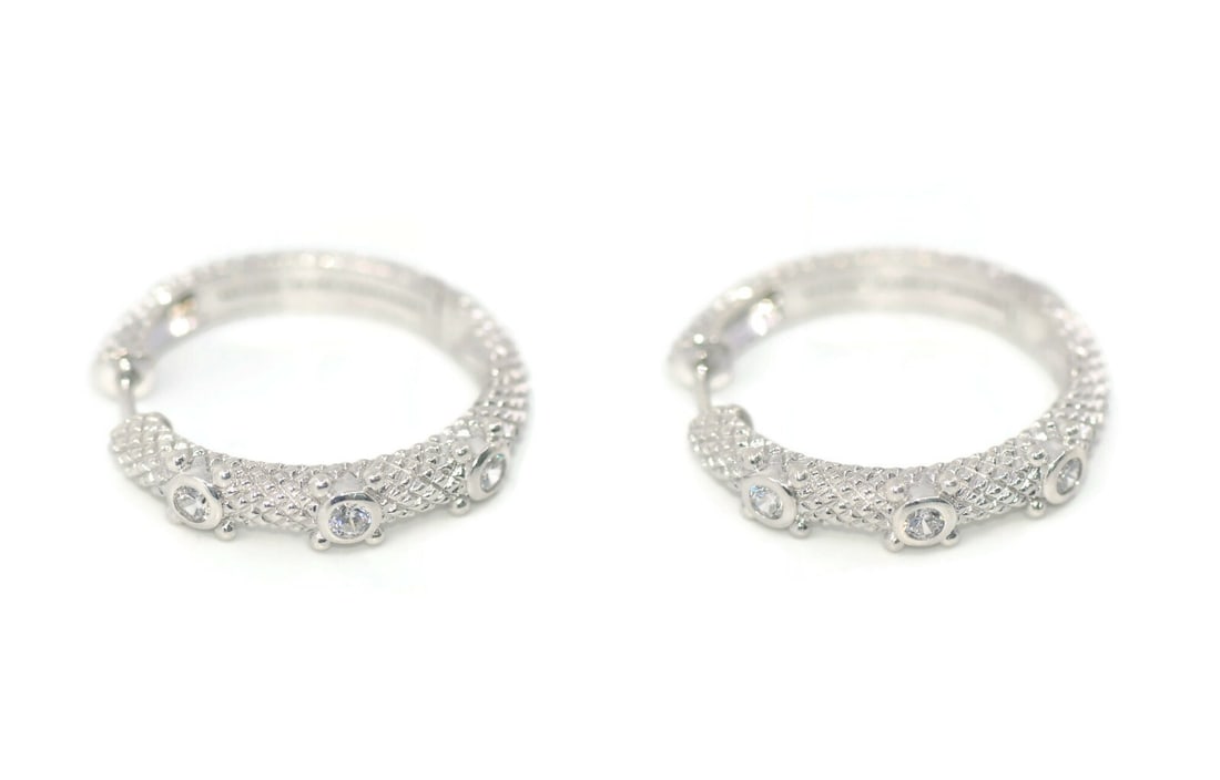 Judith Ripka Sterling Silver 26mm Hoop Earrings Authentic: Judith Ripka Sterling Silver 26mm Hoop Earrings Authentic Enhance your jewelry collection with these stunning Judith Ripka hoop earrings, crafted from high-quality sterling silver. The earrings featur