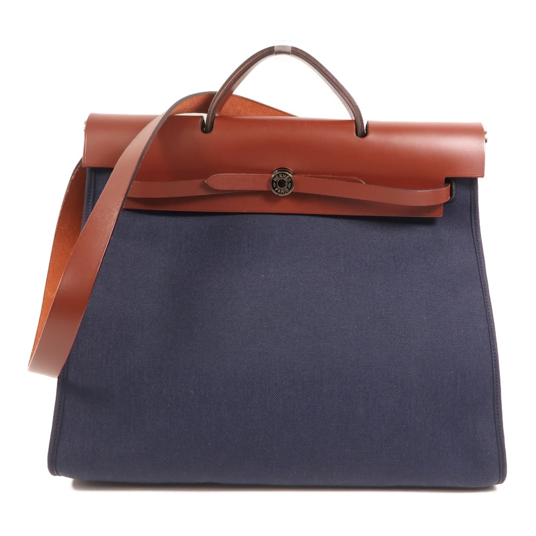 Herbag GM Canvas Navy and Brown Shoulder Bag by Hermes: Herbag GM Canvas Navy and Brown Shoulder Bag by Hermes This Hermes Herbag GM is a versatile 2-way shoulder bag crafted from navy canvas with brown accents. Designed for women, it features a spacious i