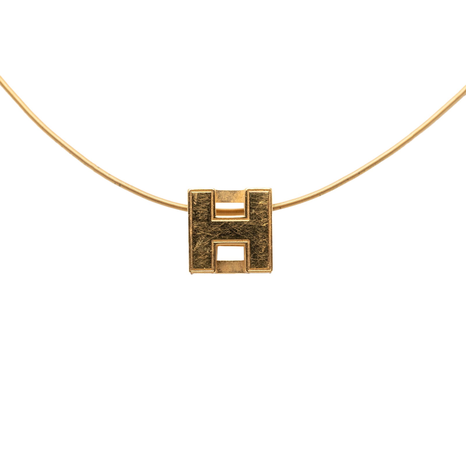 Hermes Enamel Cage Pendant Necklace with Gold Plated Snake Chain: Hermes Enamel Cage Pendant Necklace with Gold Plated Snake Chain This Hermes necklace features a pendant with enamel detailing and a gold plated metal cage design. The piece is completed with a gold p