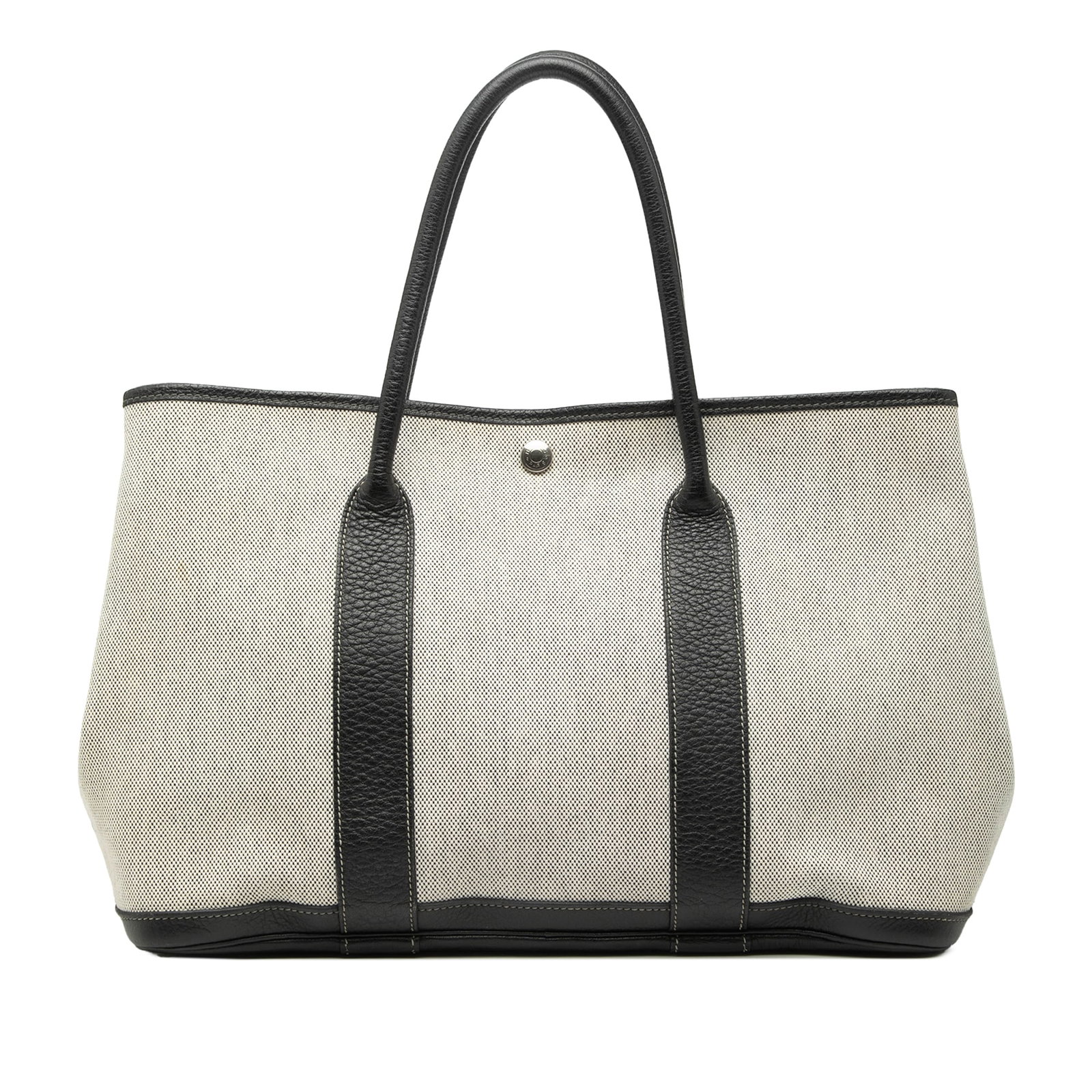 Hermes Garden Party 36 Canvas and Leather Tote Bag Beige: Hermes Garden Party 36 Canvas and Leather Tote Bag Beige This Hermes Toile and Negonda Garden Party 36 bag features a beige canvas and leather exterior, rolled leather handles, and a top snap button c