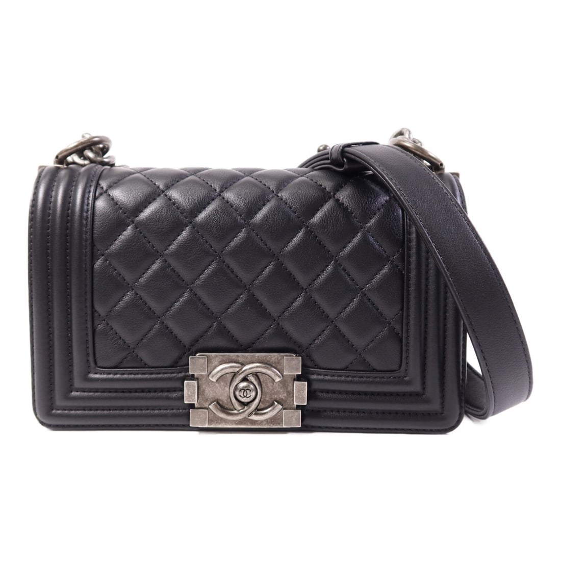 Chanel Boy 20 Black Calfskin Leather Shoulder Bag with Silver Hardware: Chanel Boy 20 Black Calfskin Leather Shoulder Bag with Silver Hardware This Chanel Boy 20 chain shoulder bag is crafted from black calfskin leather and features silver-tone hardware. Designed for vers