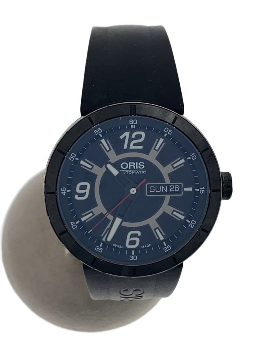 ORIS TT1 Motorsport Black Men's Wristwatch: ORIS TT1 Motorsport Black Men's Wristwatch This ORIS Motorsport Collection TT1 men's wristwatch features a black dial and a Swiss-made design. The watch is pre-owned and in slightly used condition, of