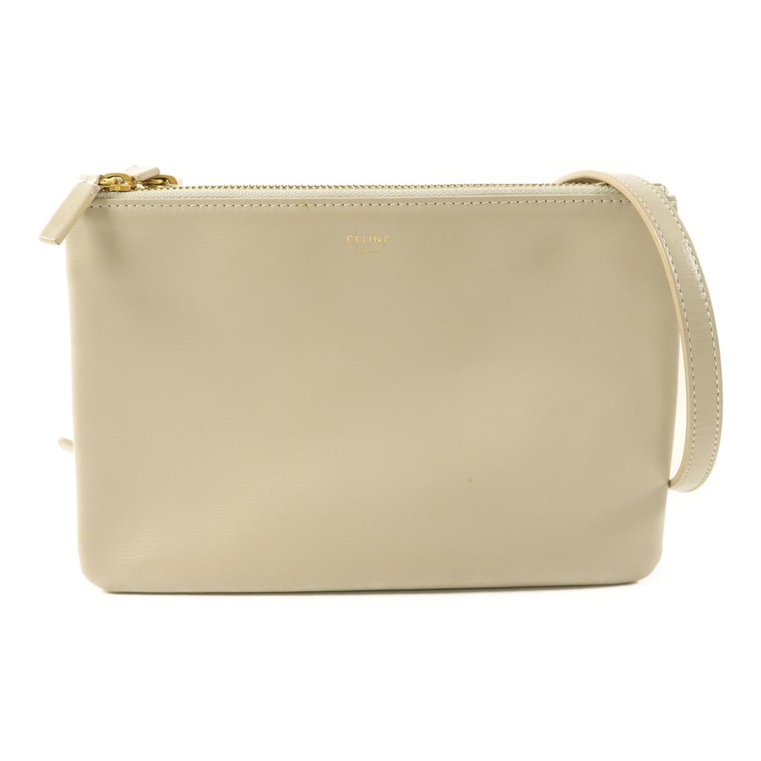 Trio Shoulder Bag in Grey Calfskin with Gold Hardware by CELINE: Trio Shoulder Bag in Grey Calfskin with Gold Hardware by CELINE This CELINE Trio shoulder bag features a sleek gray calfskin leather exterior with gold-toned hardware. Designed for women, it offers a 