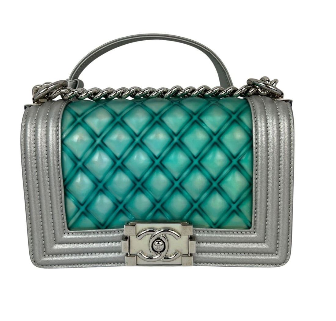 Chanel Small Boy Silver Blue Quilted Iridescent Lambskin PVC Shoulder Bag: Chanel Small Boy Silver Blue Quilted Iridescent Lambskin PVC Shoulder Bag This Chanel Iridescent Lambskin PVC Quilted Small Boy Flap Bag features a striking silver blue color with a rectangle silhouet