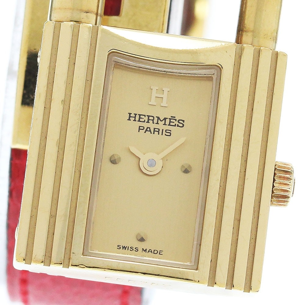 Hermes Kelly Quartz Ladies Leather Bracelet Watch: Hermes Kelly Quartz Ladies Leather Bracelet Watch This Hermes Kelly Watch is a pre-owned women's wristwatch featuring a stainless steel and gold-plated case paired with a leather bracelet. The watch i