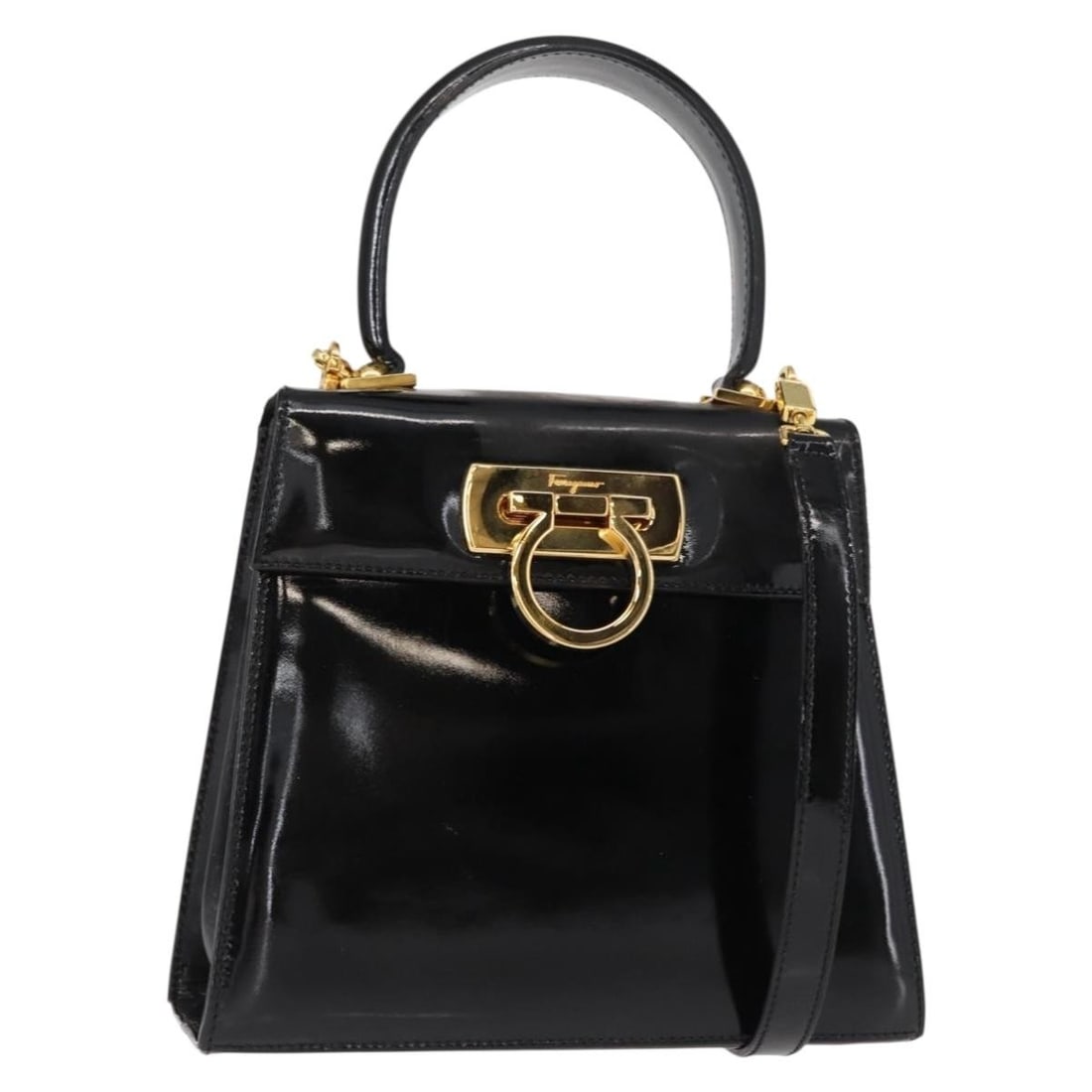 Black Patent Leather Gancini Bag by Salvatore Ferragamo: Black Patent Leather Gancini Bag by Salvatore Ferragamo This pre-owned Salvatore Ferragamo Gancini handbag is crafted from black patent leather and designed for female use. It features a structured si