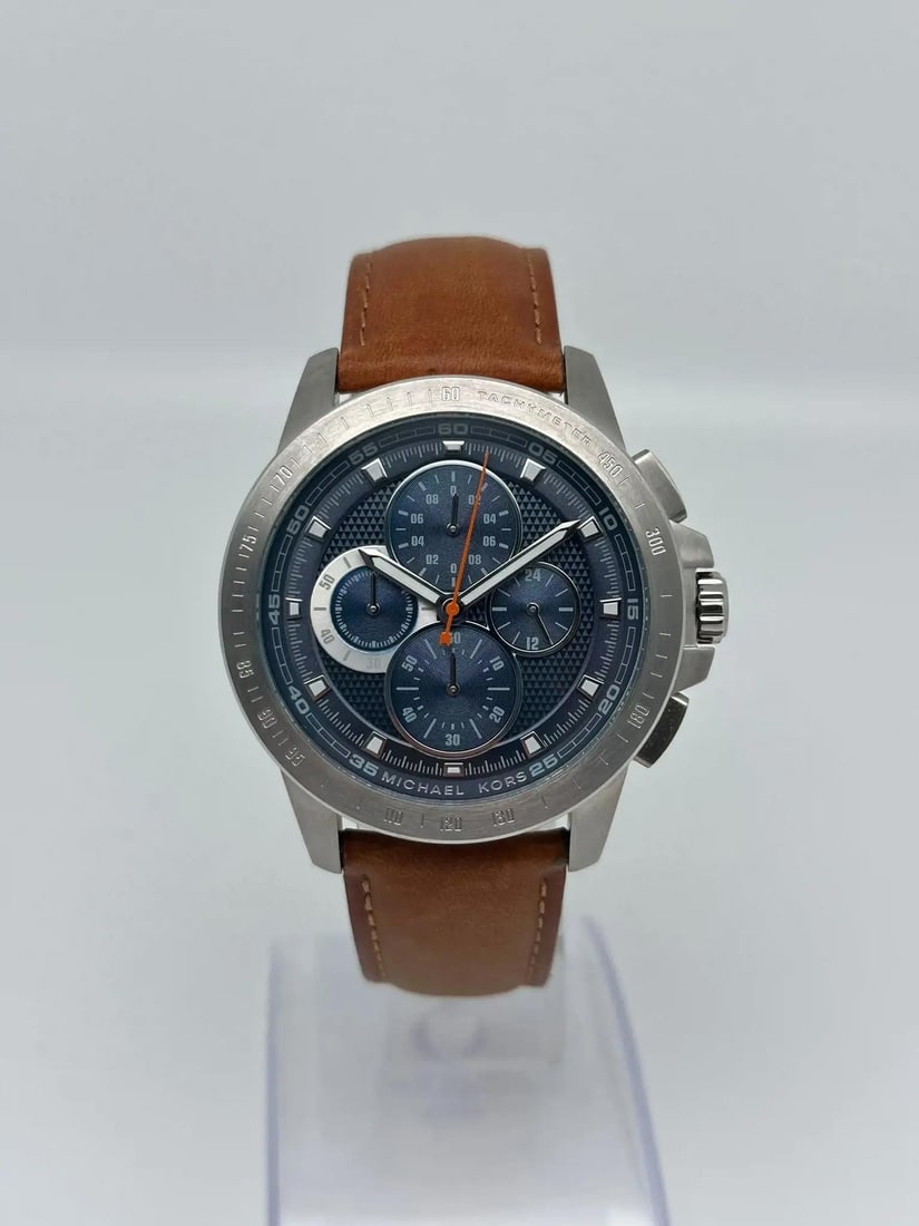 Michael Kors Ryker 43mm Chronograph Blue Dial Men's Quartz Watch MK8518: Michael Kors Ryker 43mm Chronograph Blue Dial Men's Quartz Watch MK8518 Discover the Michael Kors Ryker Steel 43mm Chronograph Quartz Watch, designed for the modern man. This wristwatch features a str