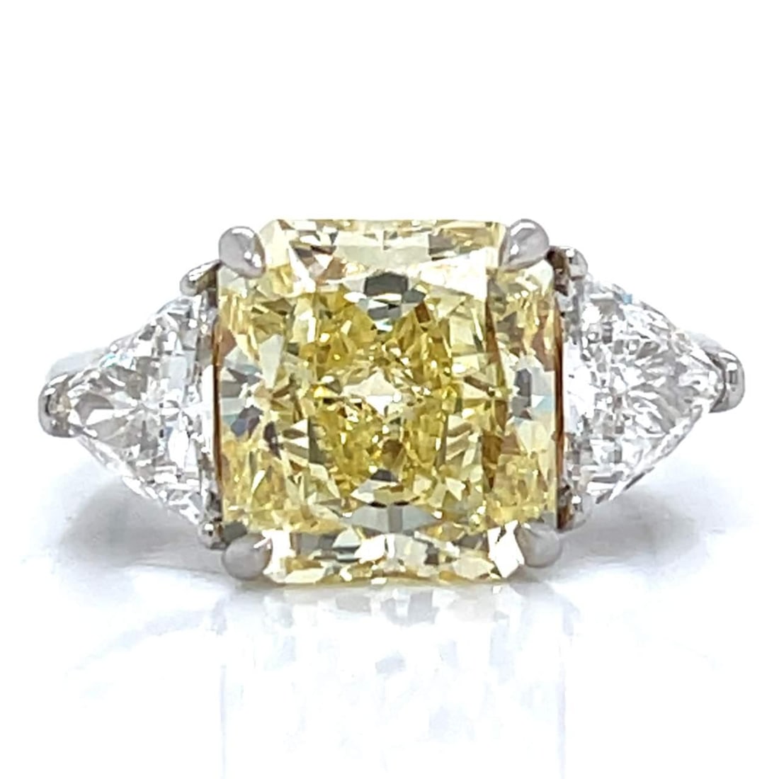 GIA Certified 5.71 Ct Fancy Yellow Diamond Ring in Platinum & 18K Gold: GIA Certified 5.71 Ct Fancy Yellow Diamond Ring in Platinum & 18K Gold This exquisite ring showcases a stunning GIA Certified 5.71 Ct. Fancy Yellow Diamond, elegantly set in a combination of platinum 