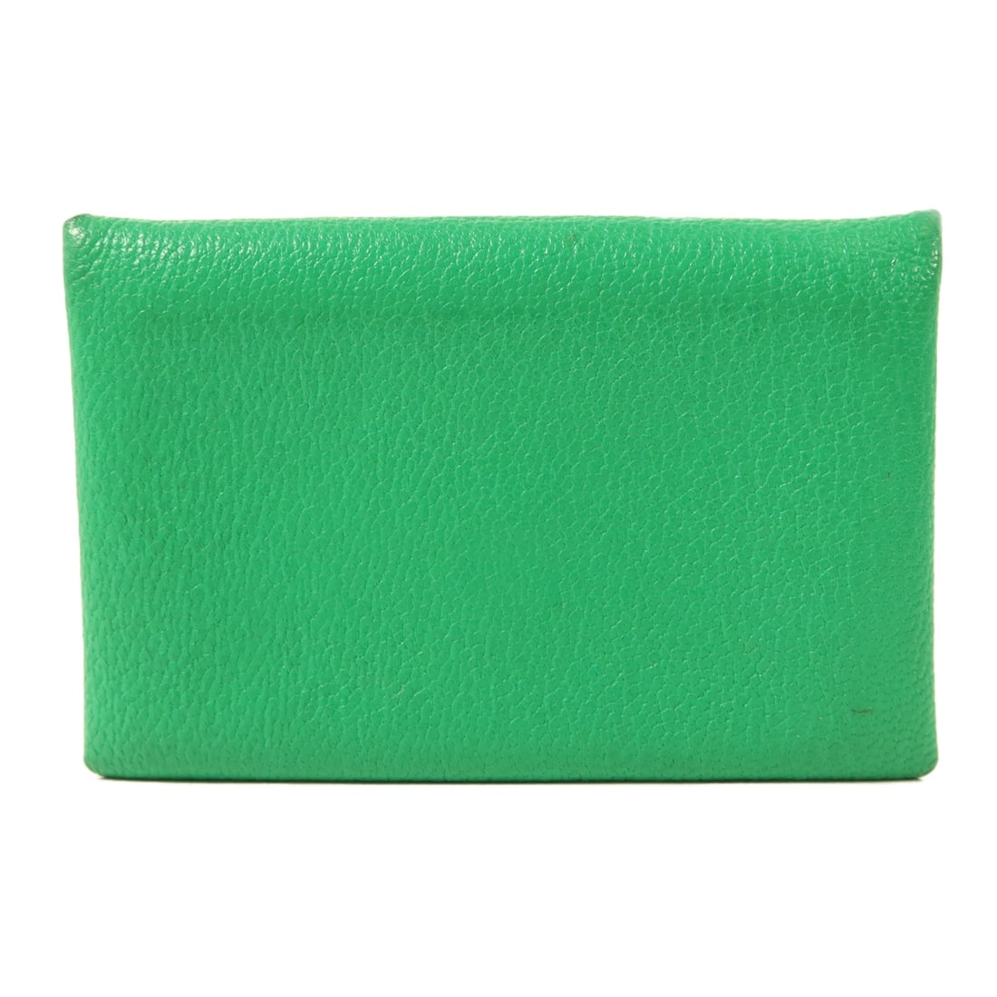 Calvi Green Chevre Leather Card Holder with Palladium Hardware by Hermes: Calvi Green Chevre Leather Card Holder with Palladium Hardware by Hermes This Hermes Calvi card case is crafted from goatskin leather in a green color. Designed for women, it features palladium hardwa