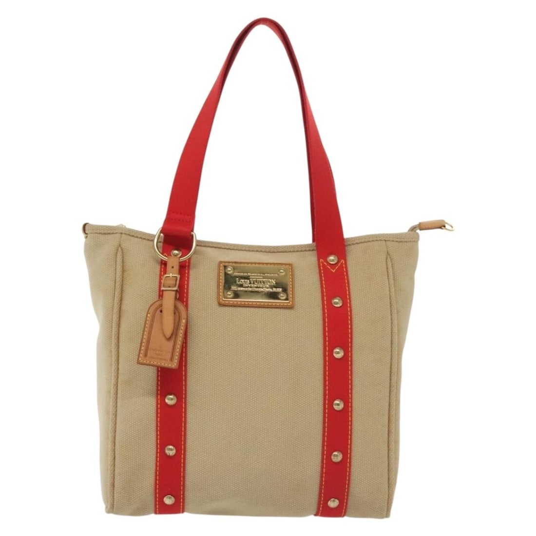 Louis Vuitton Beige Canvas Antigua Tote Bag 29cm by 30cm by 9.5cm: Louis Vuitton Beige Canvas Antigua Tote Bag 29cm by 30cm by 9.5cm The Louis Vuitton Antigua Tote is crafted from beige canvas and designed for women. This tote features a spacious design with dimensio
