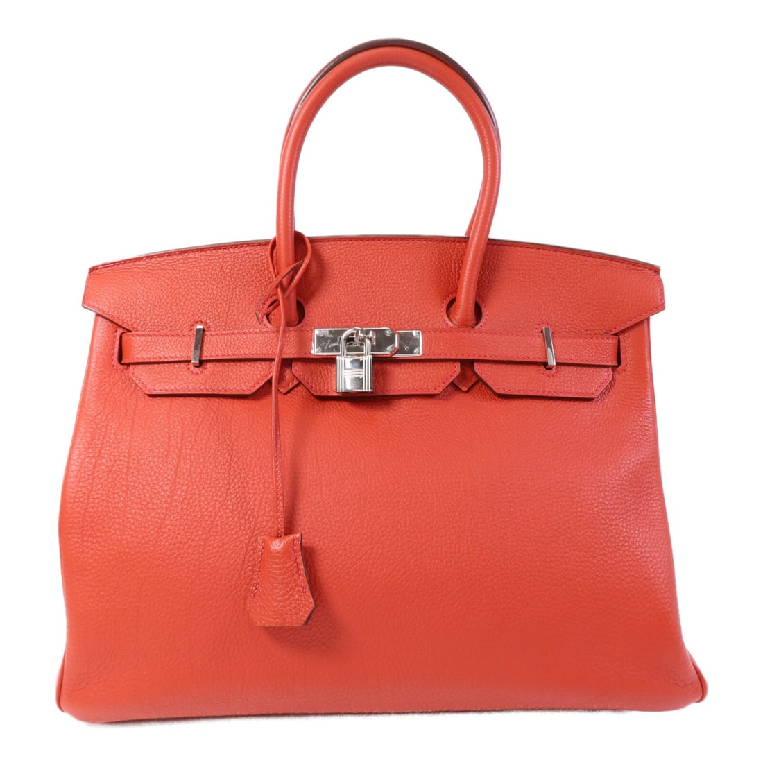 Hermes Birkin 35 Red Togo Leather Handbag Palladium Hardware: Hermes Birkin 35 Red Togo Leather Handbag Palladium Hardware This Hermes Birkin 35 handbag is crafted from Togo calfskin leather in a striking Rouge De Coeur red shade. Designed for women, it features