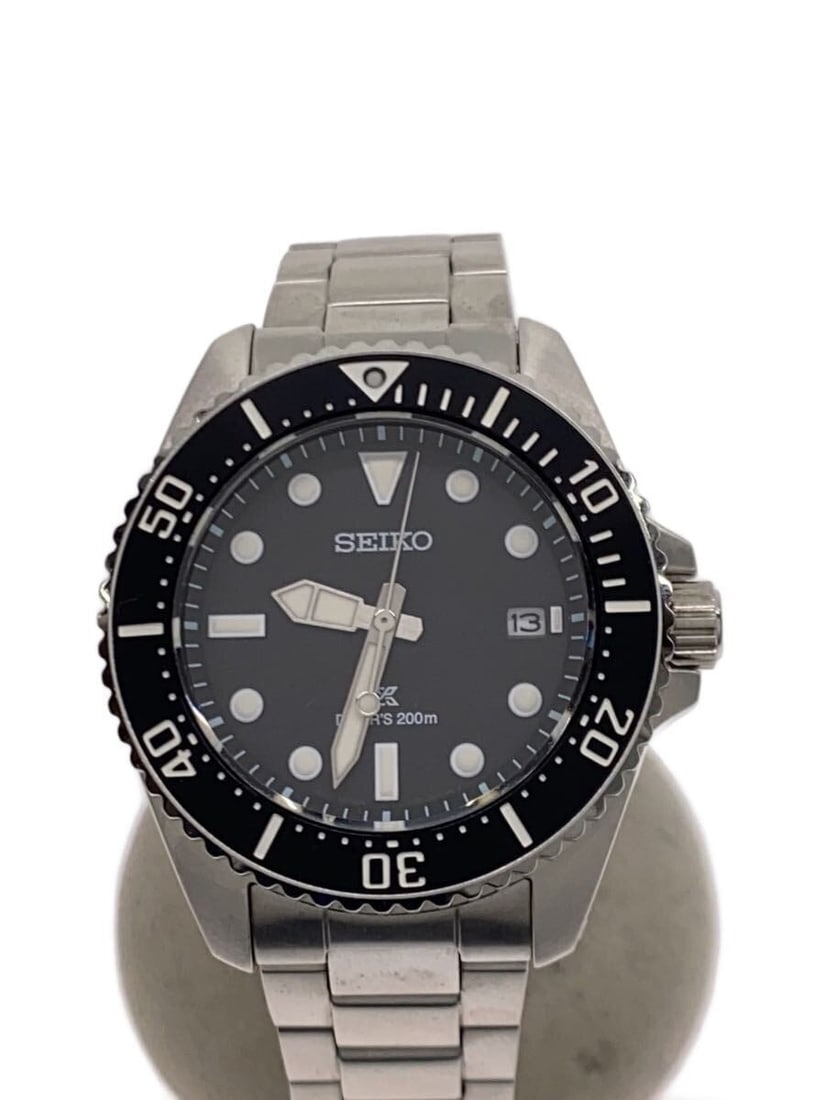 Seiko Prospex V157-00A0 Black Men's Diver Wristwatch: Seiko Prospex V157-00A0 Black Men's Diver Wristwatch This SEIKO Prospex Diver Scuba V157-00A0 is a men's wristwatch featuring a black color scheme. Made in Japan, this pre-owned watch is graded as B, 