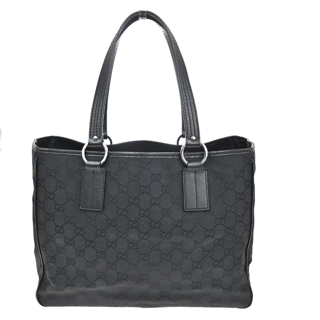 Vintage Gucci Black Canvas Open Tote Handbag 32.5x25x12.5cm: Vintage Gucci Black Canvas Open Tote Handbag 32.5x25x12.5cm This vintage Gucci open tote for women is crafted from black canvas and features the iconic GG pattern. It offers practical dimensions suita