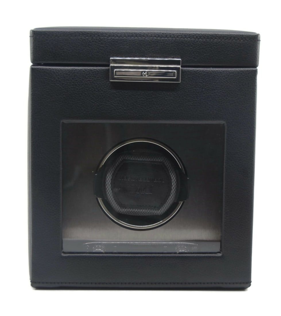 IWC Wolf Design Black Leather Single Watch Winder 9x8x8: IWC Wolf Design Black Leather Single Watch Winder 9x8x8 Presenting the IWC Wolf Design Black Leather Watch Winder, an elegant and functional accessory for watch enthusiasts. This presentation box is c