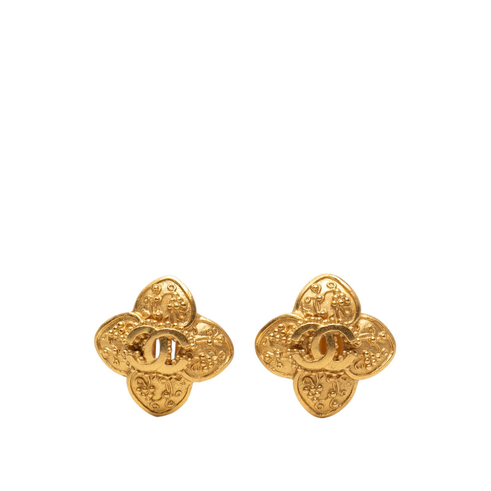 Chanel Clover Motif Gold Plated Metal Clip On Earrings: Chanel Clover Motif Gold Plated Metal Clip On Earrings These Chanel CC Clover earrings feature gold plated metal bodies with a clip-on closure. Designed as costume jewelry, they showcase the iconic CC