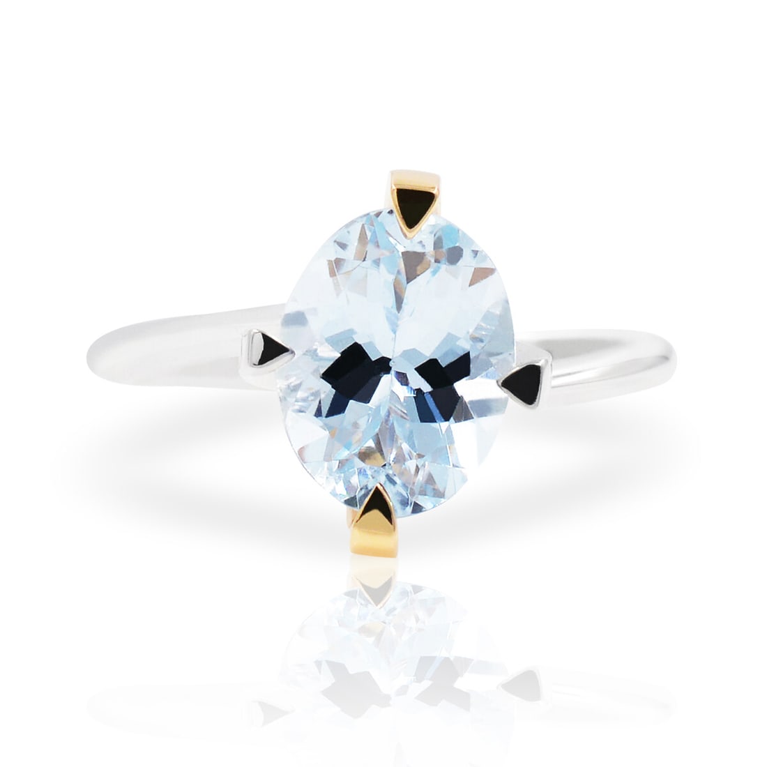 Comete 18K Two Tone Gold Ring with Oval Aquamarine: Comete 18K Two Tone Gold Ring with Oval Aquamarine Elevate your jewelry collection with this stunning Comete Aquamarine Two Tone Gold Ladies Ring. Crafted from 18K two-tone gold, this exquisite ring s
