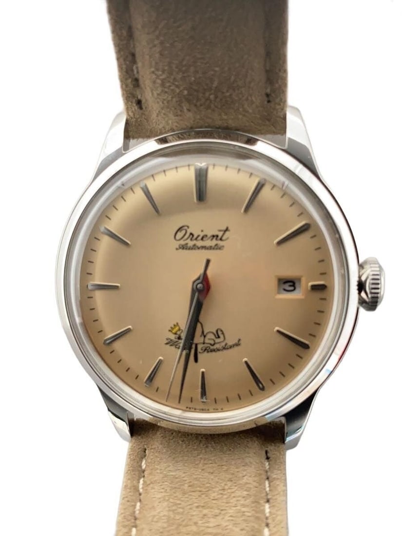 Orient Peanuts Bambino Khaki Stainless Steel Men's Wristwatch: Orient Peanuts Bambino Khaki Stainless Steel Men's Wristwatch This ORIENT x PEANUTS Bambino RN-AC0M17G men's wristwatch features a khaki dial and a stainless steel case. Made in Japan, the watch is in