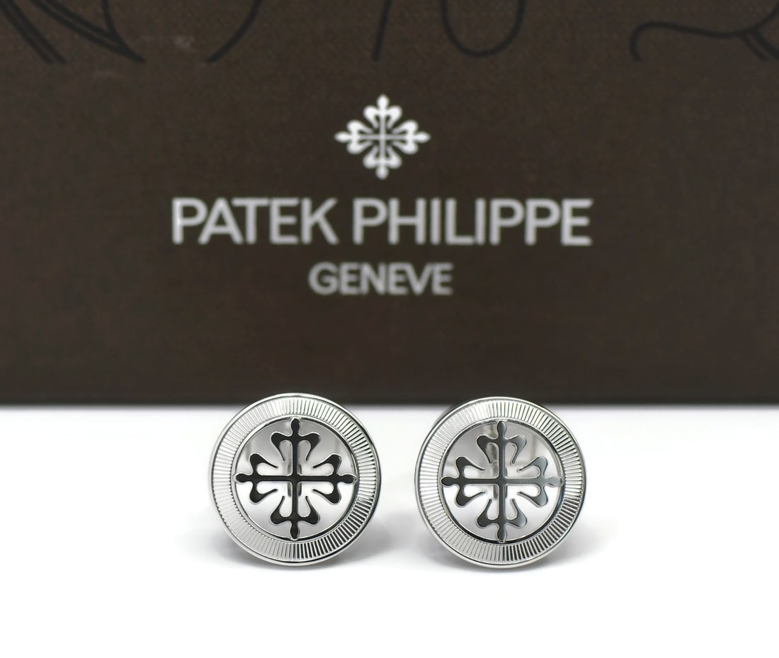 18K White Gold Calatrava Cufflinks by Patek Philippe with Box: 18K White Gold Calatrava Cufflinks by Patek Philippe with Box These Patek Philippe Calatrava cufflinks are crafted from 18K white gold and designed for men. Made in Switzerland, these pre-owned cuffli