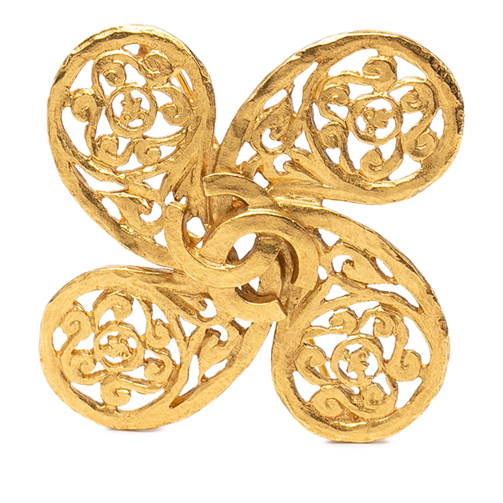 Chanel Clover Brooch Gold Plated Metal CC Fretwork Design: Chanel Clover Brooch Gold Plated Metal CC Fretwork Design This Chanel brooch features a gold-plated metal body with a CC fretwork clover design and a pin back closure. Made in France, it is categorize