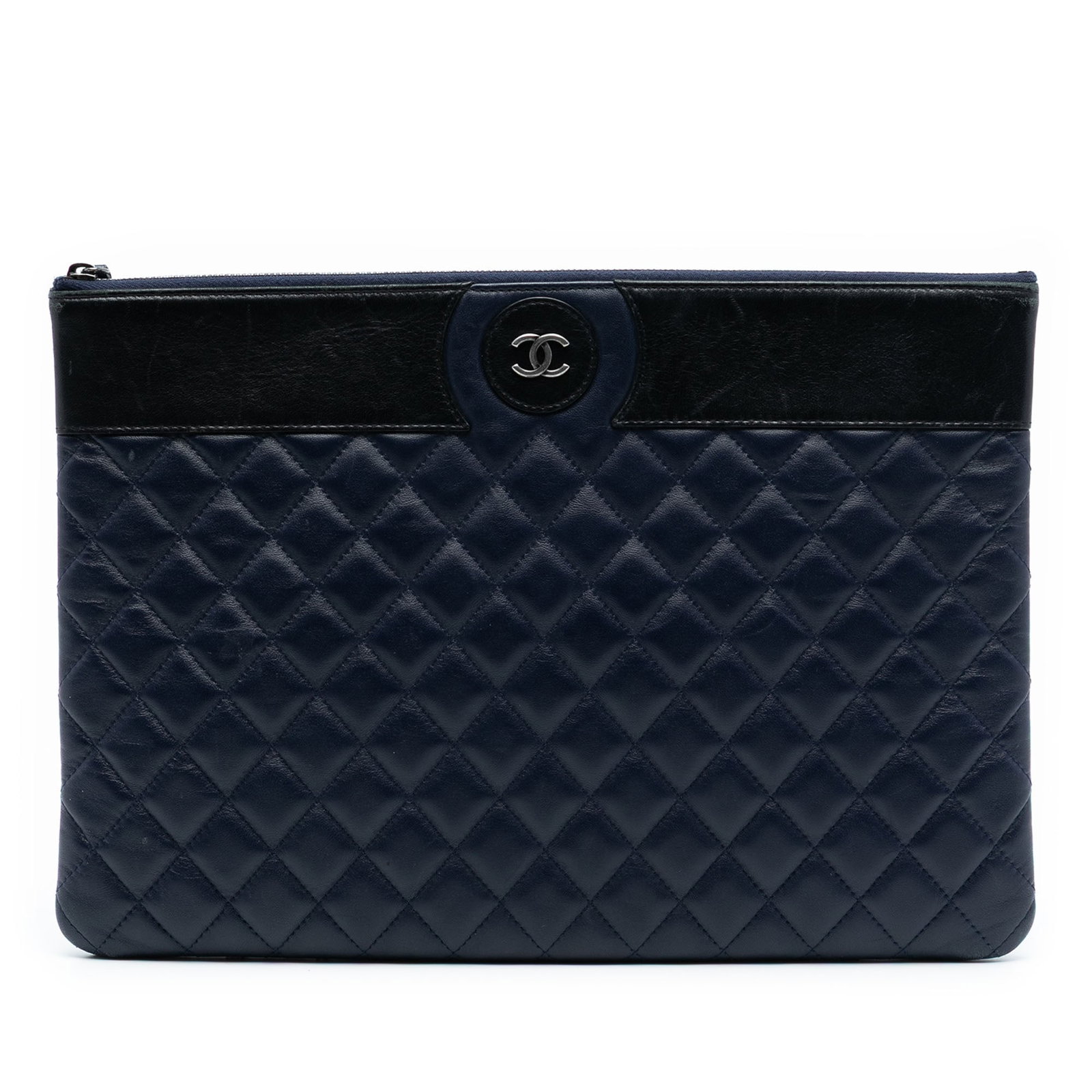Bicolor Quilted Lambskin Clutch Bag by Chanel Large CC: Bicolor Quilted Lambskin Clutch Bag by Chanel Large CC This Chanel Large CC Bicolor Quilted Lambskin Clutch features a quilted leather exterior in a blue bicolor design and a top zip closure. The bag 