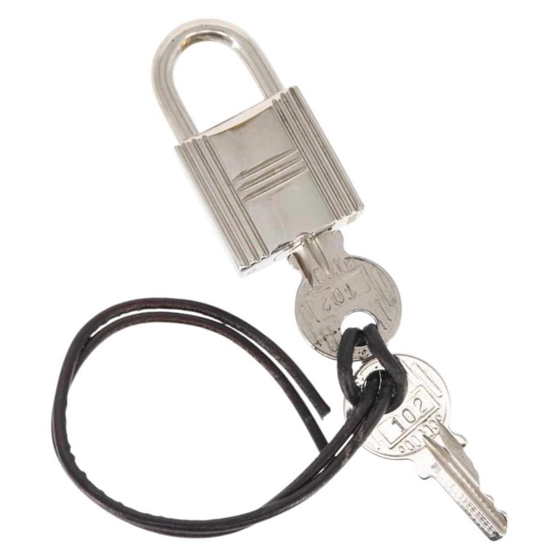 HERMES Silver Metal Cadena Padlock with 2 Keys: HERMES Silver Metal Cadena Padlock with 2 Keys This authentic HERMES Cadena Padlock is crafted from durable metal and features a sleek silver finish. With approximate dimensions of 0.8 inches in lengt