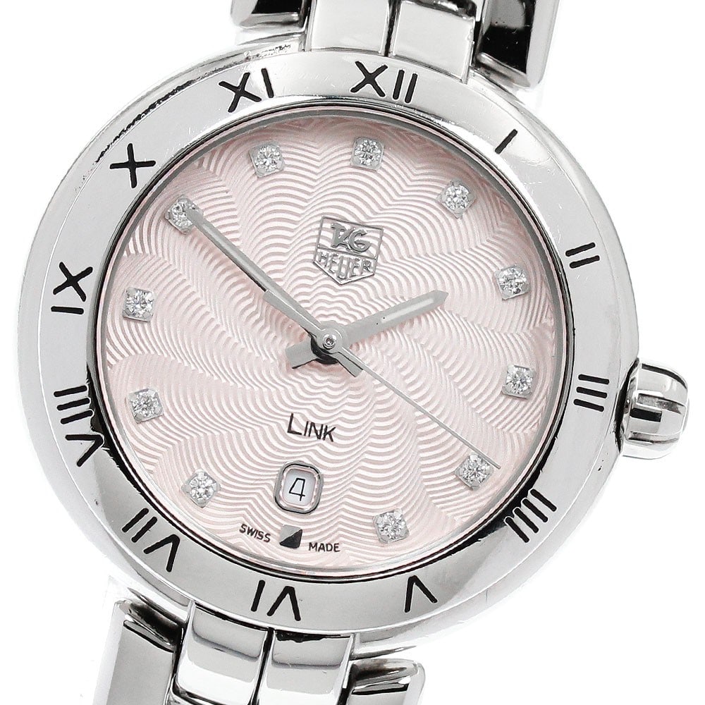 TAG Heuer Link Date Quartz Pink Dial Women's Wristwatch: TAG Heuer Link Date Quartz Pink Dial Women's Wristwatch This TAG Heuer Link Date Quartz women's wristwatch features a stainless steel case and bracelet with a pink dial. The watch is powered by a quar