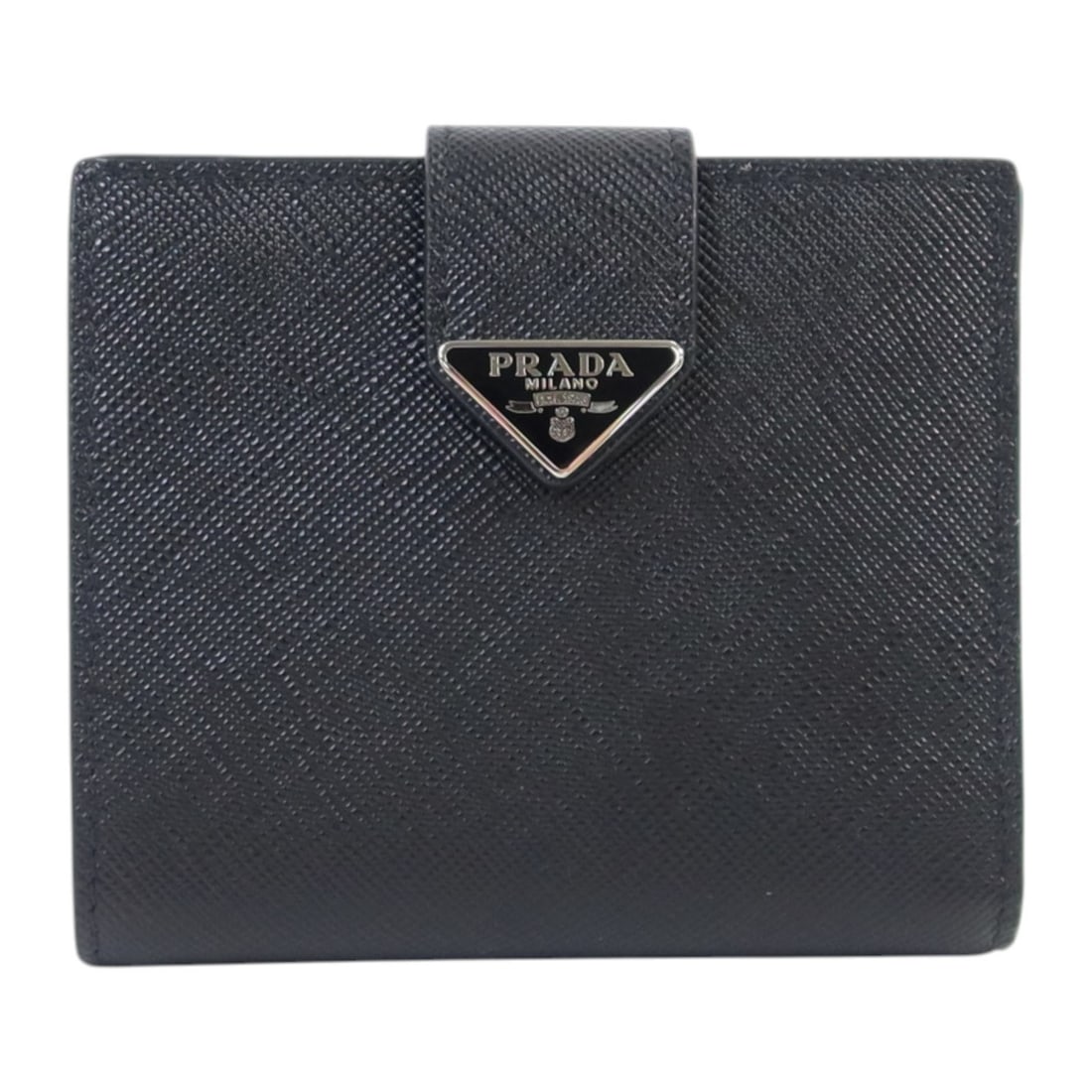 Prada Black Saffiano Leather Bifold Wallet with Silver Hardware: Prada Black Saffiano Leather Bifold Wallet with Silver Hardware This Prada short flap bi-fold wallet is crafted from black Saffiano leather, offering a sleek and durable option for everyday use. Desig